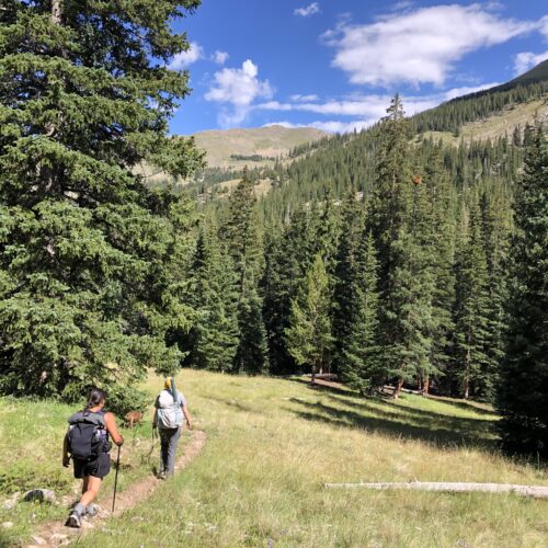 two girls hike on a trail near Salida Colorado